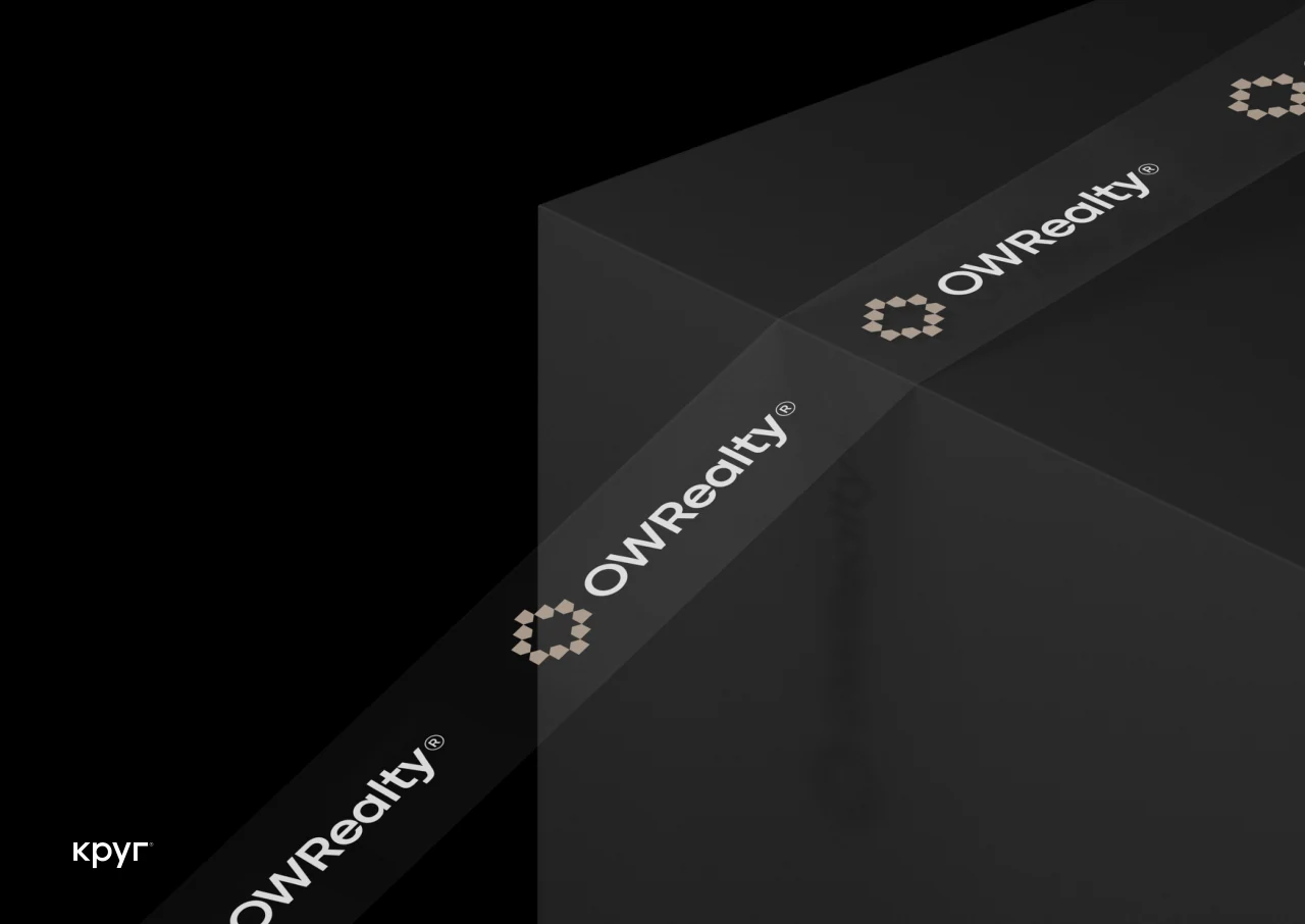 OW Realty: The identity on a dark architectural surface.